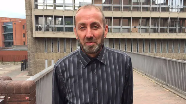 Robert Pearson standing outside court