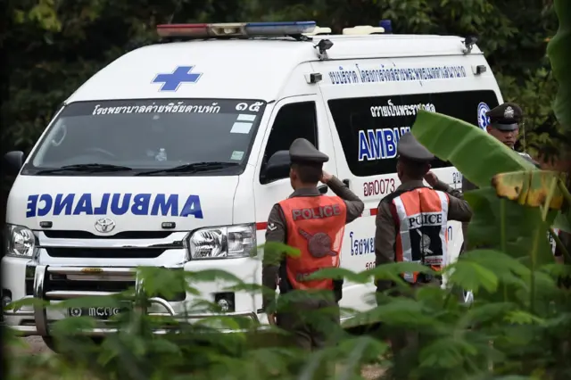 An ambulance exits from the Tham Luang cave area