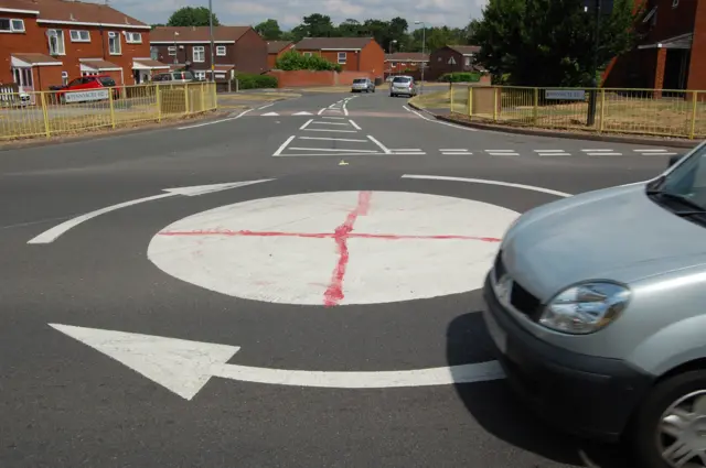 Mini roundabout with Cross of St George