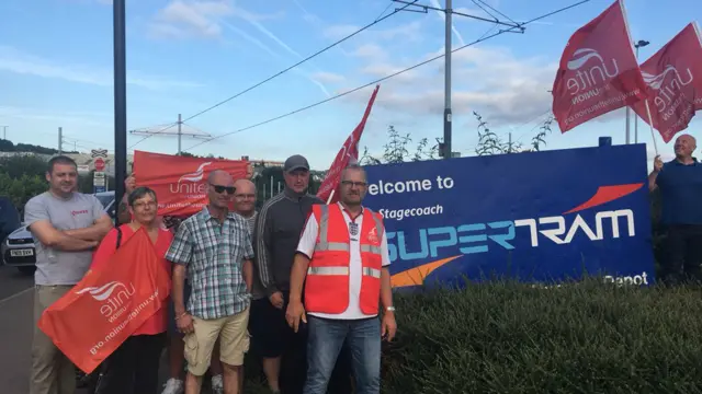 Drivers and conductors outside the depot this morning