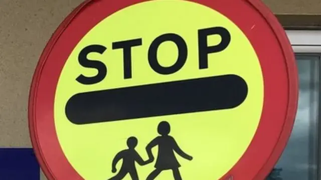 School crossing lollipop sign