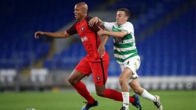 New Saints' Tom Holland battles with Midtjylland's Simon Okosun