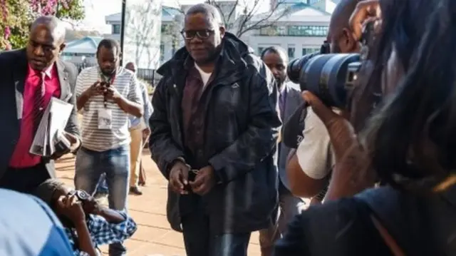 Tendai Biti in handcuffs