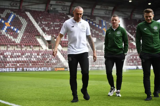 Celtic players inspect the pitch at Tynecastle