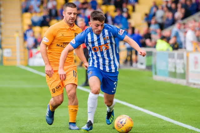 Kilmarnock's Greg Taylor (right) holds off Livingston's Scott Robinson