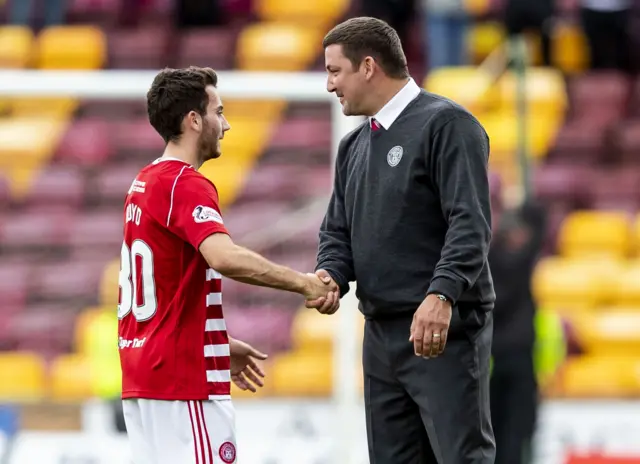 Martin Canning shakes hands with Hamilton match-winner Steven Boyd