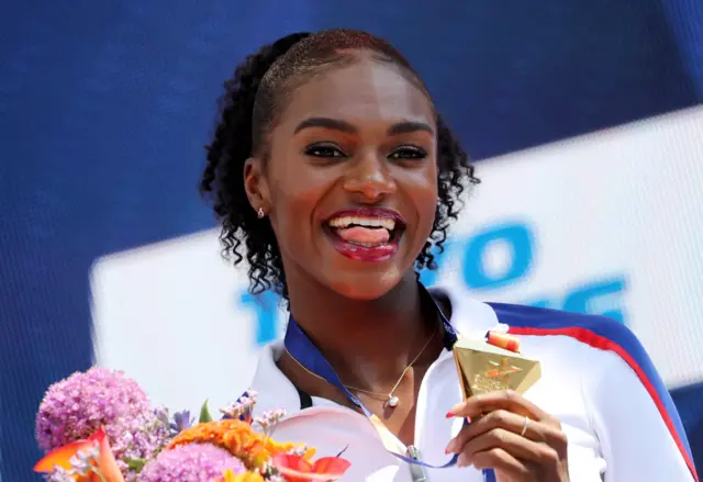 Dina Asher-Smith receives her gold medal after winning the European 200m final.