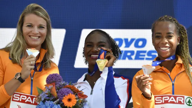 Dina Asher-Smith collects her 200m gold medal at the European Championship