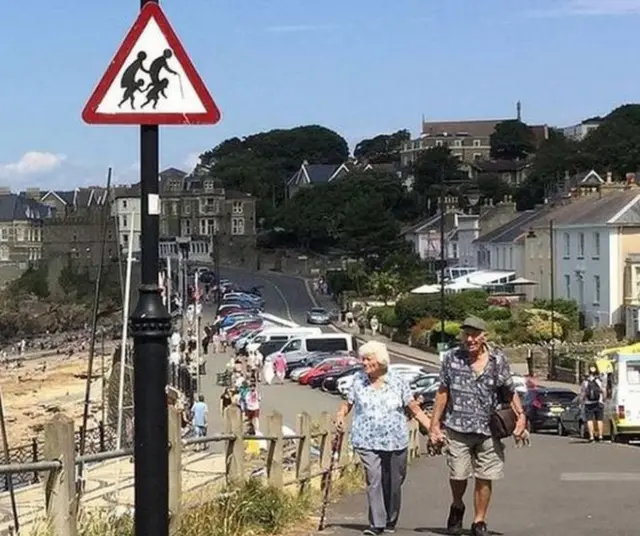 Banksy road sign