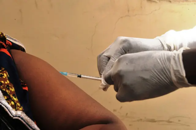 A woman gets vaccinated on March 10, 2015 at a health center in Conakry during the first clinical trials of the VSV-EBOV vaccine against the Ebola virus. The World Health Organization (WHO) said on March 5 that clinical trials launched on March 7 in Guinea marked the last step before the vaccine is available on the market.