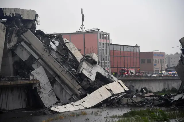 Huge sections of concrete lie in the stream after the collapse