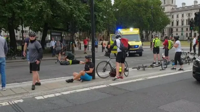 Cyclists were seen on the ground after the crash