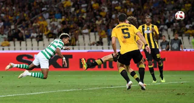 Scott Sinclair stoops to pull a goal back for Celtic