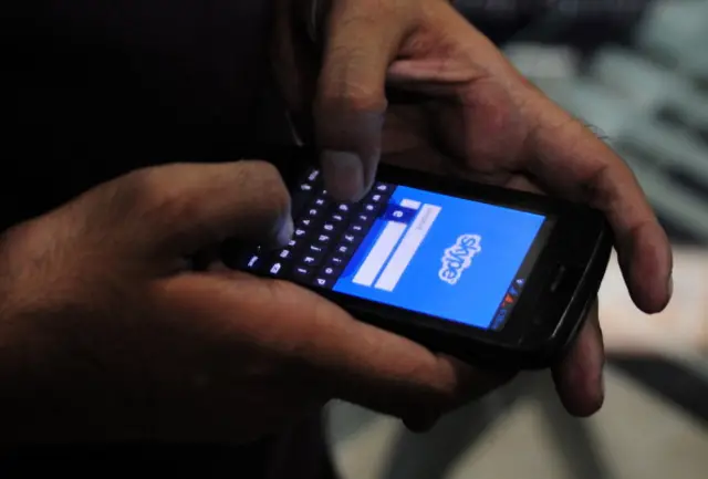 A man tries to connect to the Skype network on his mobile