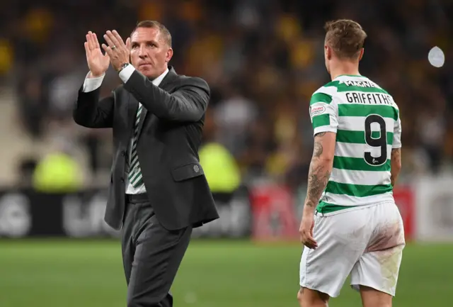 Celtic manager Brendan Rodgers applauds the visiting fans in Athens