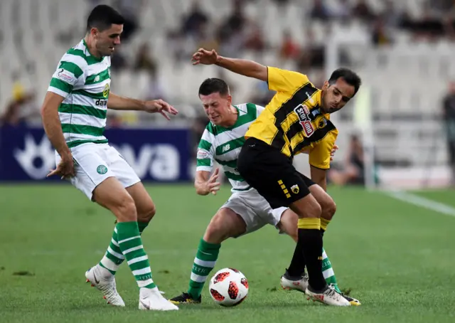 Tom Rogic and James Forrest playing for Celtic against AEK Athens