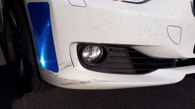 A damaged police car