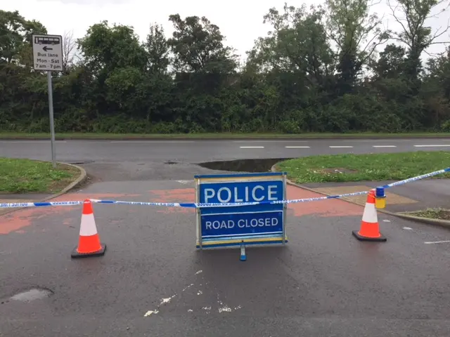 Police road closed sign