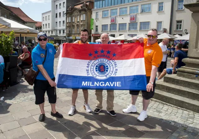 Rangers fans show off their colours in the town square