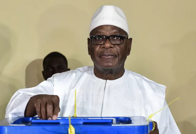 President Ibrahim Boubacar Keita casts his vote at a polling station in Bamako on August 12, 2018 during the second round of Mali's presidential election