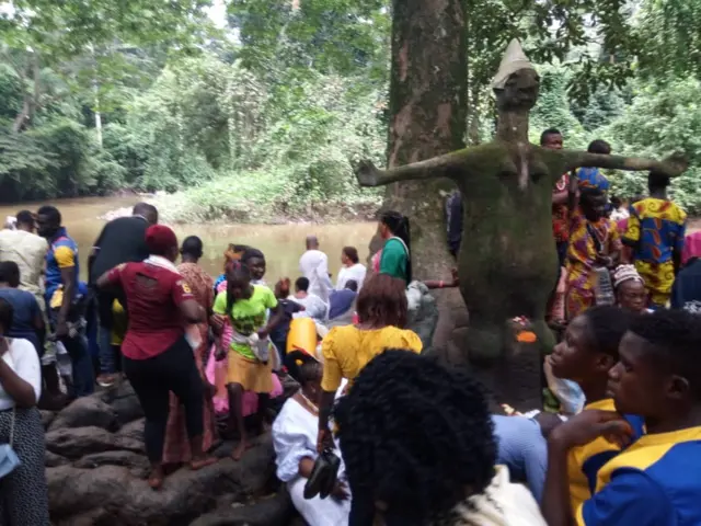 Worshippers by the river