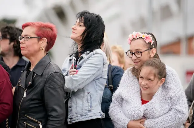 Families hug outside stadium