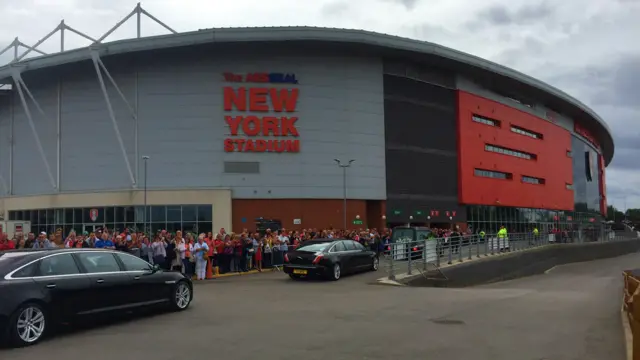 Coffin arriving at the New York Stadium