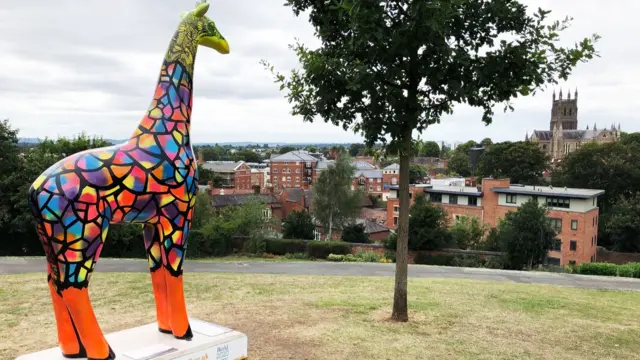 Giraffe back on plinth