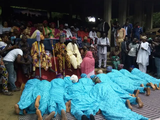 Believer lay on the ground as they pay homage to the Osogbo traditional ruler