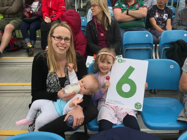 Mum Anna, baby Sophie in arms and daughter Eleanor, 4, holding a 6