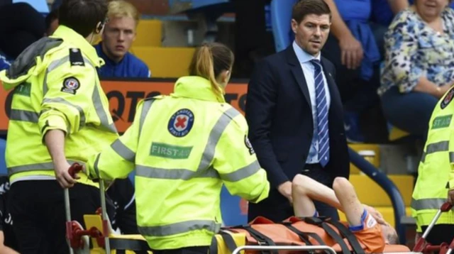 Rangers manager Steven Gerrard watches Jamie Murphy being stretchered off