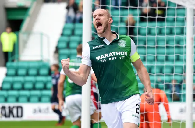 David Gray celebrates his equaliser for Hibs