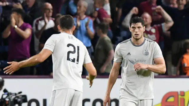 Aberdeen’s Dom Ball (left) speaks to Scott McKenna