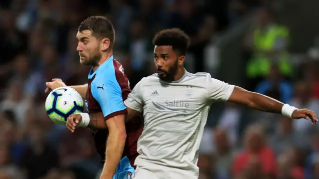 Burnley's Ashley Westwood challenges Aberdeen"s Tommie Hoban