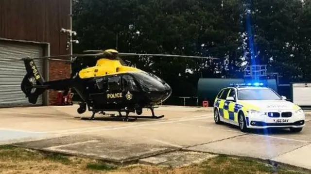 Police helicopter and car