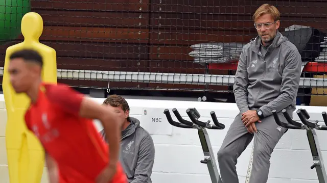 Jurgen Klopp watches Liverpool train