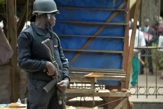 A policeman guards the entrance to offices of Cameroon's opposition SDF party (pictured in February 2018)