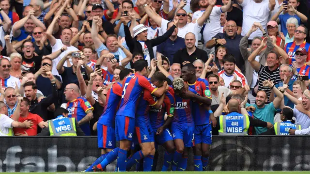 Crystal Palace players celebrate scoring at Fulham