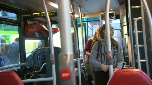 Passengers getting on a bus