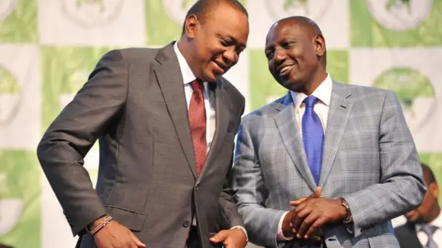 Kenya's president-elect, Uhuru Kenyatta (L) with his running mate William Ruto wait to receive their certificates of election October 30, 2017