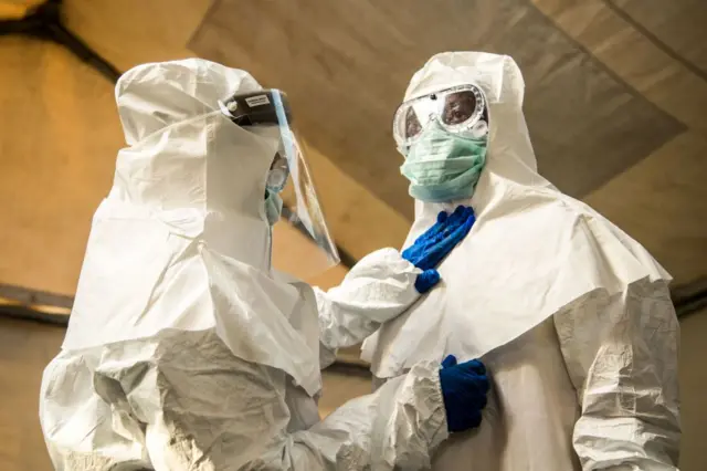 Medical staff in protective suits