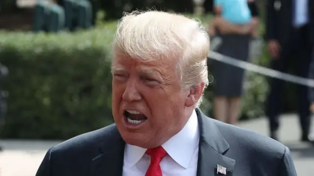 U.S. President Donald Trump speaks to the media before departing on Marine One to travel to New York, at the White House on August 17, 2018 in Washington, DC.