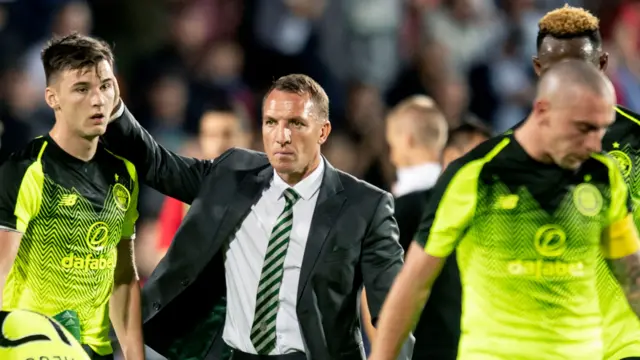 Celtic manager Brendan Rodgers congratulates his players