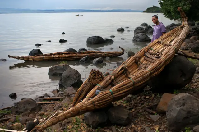 Tis Isat or Blue Nile waterfalls, Bahar Dar, Ethiopia, Africa. Papyrus canopies next to Papyrus Canoe next to Lake Tana