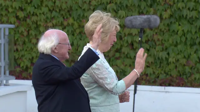 President Michael D Higgins waves goodbye to the Pope