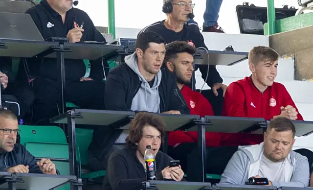 Scott McKenna watches Aberdeen's game at Hibs from the stands