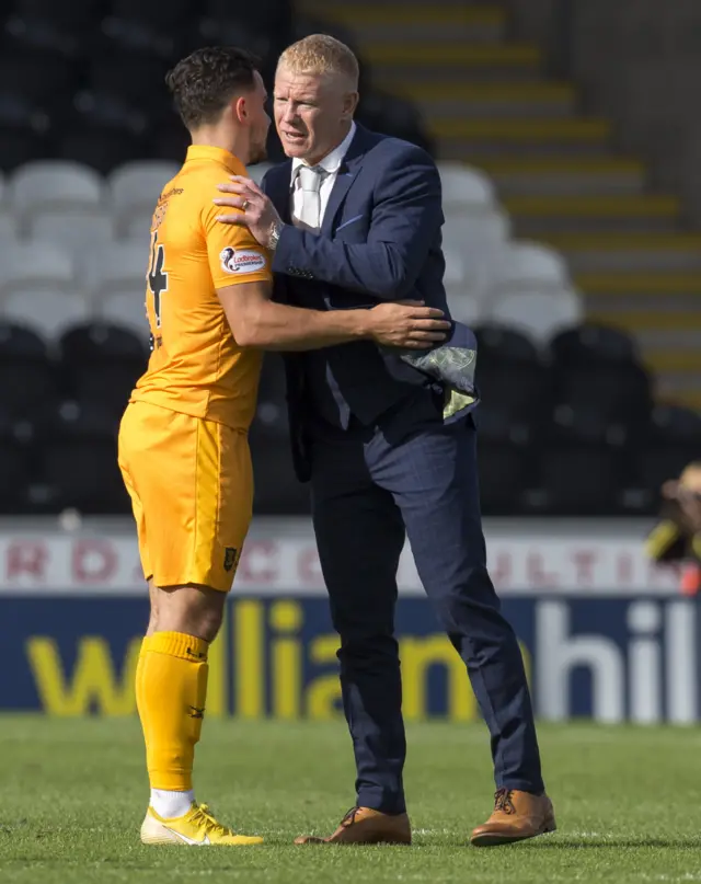 Livingston manager Gary Holt congratulates Egli Kaja at full-time