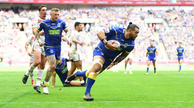 Ben Murdoch-Masila of Warrington Wolves runs over to score a try