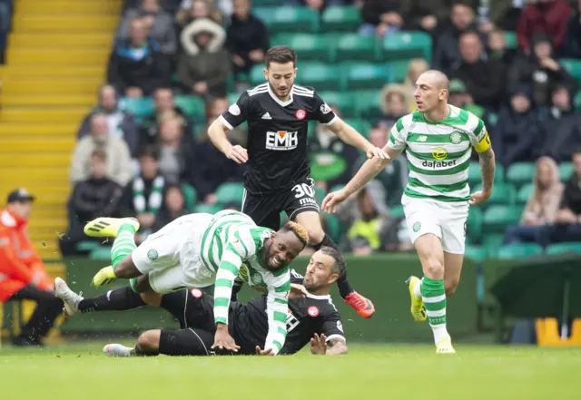 Moussa Dembele is tackled by Dougie Imrie