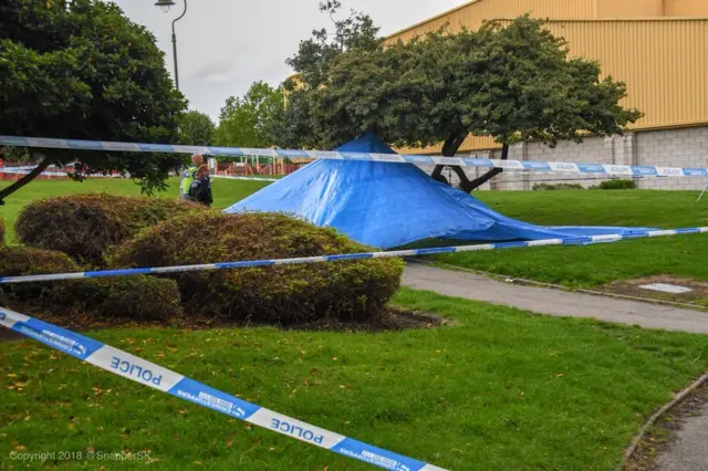 Blue police tent and cordon in Handsworth Park